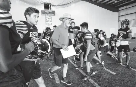  ??  ?? Refugio football coach Jason Herring has been at the heart of helping struggling families find their footing after Hurricane Harvey. Photos by Elizabeth Conley / Staff photograph­er