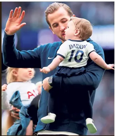  ??  ?? I’ll be there: Tottenham’s Harry Kane with his daughter. — Reuters