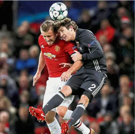  ?? — Reuters ?? Head game: Manchester United’s Luke Shaw in action with CSKA Moscow’s Mario Fernandes on Tuesday.