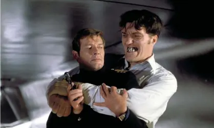  ??  ?? Escape artist ... Roger Moore with Richard Kiel in The Spy Who Loved Me (1977). Photograph: Allstar/United Artists/Eon Production­s
