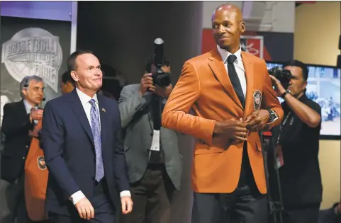  ?? Jessica Hill / Associated Press ?? Basketball Hall of Fame inductee Ray Allen, right, smiles after he was presented his Hall of Fame jacket by Naismith Memorial Basketball Hall of Fame President and CEO John Doleva Thursday.