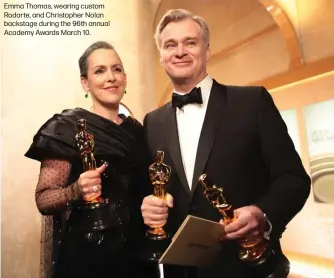  ?? ?? Emma Thomas, wearing custom Rodarte, and Christophe­r Nolan backstage during the 96th annual Academy Awards March 10.