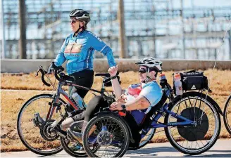  ?? [PHOTOS BY JIM BECKEL, THE OKLAHOMAN] ?? After a ceremony marking the completion of MAPS 3 Will Rogers Trail, cyclists rode the trail east of May between Interstate 40 and the Oklahoma River.