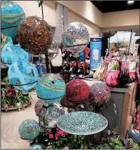  ?? Special to the Democrat-Gazette/JANET B. CARSON ?? Gazing balls and mosaic birdbaths beckon shoppers at the 2017 Arkansas Flower and Garden Show.