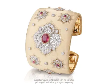  ??  ?? Buccellati Opera cuff bracelet with the signature yellow gold and white gold rigato engraving technique, set with diamonds and rubies