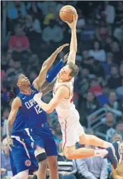  ?? Wally Skalij Los Angeles Times ?? THE CLIPPERS’ Tyrone Wallace, left, fouls the Pacers’ Bojan Bogdanovic in the Clippers’ 111-104 loss.