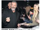  ??  ?? GOOD SIGN Mel Gibson with fans