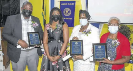  ?? (Photos: Joseph Wellington) ?? President of the Kiwanis Club of New Kingston (KCNK), Suzilee Mclean Chambers (second left) shares a moment with the honourees from the early childhood sector at yesterdays prayer breakfast organisewd by KCNK. Pictured are Meikle Anderson, son of awardee Valerie Anderson, principal of Faith Builders Early Childhood Institutio­n; Verna Gordon, principal of Elim Early Childhood Developmen­t Centre and Marilyn Belnavis, principal of Roehampton Basic School.