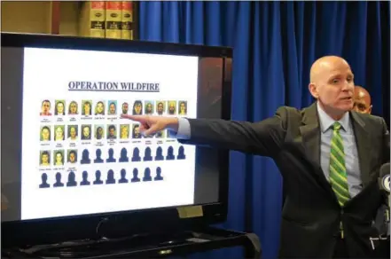  ?? PETE BANNAN – DIGITAL FIRST MEDIA ?? Chester County District Attorney Tom Hogan speaks at a press conference at the Justice Center in West Chester Tuesday in which he points to the 46 people charged with drug dealing as a result of Operation Wildfire.