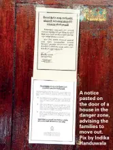  ??  ?? A notice pasted on the door of a house in the danger zone, advising the families to move out. Pix by Indika Handuwala