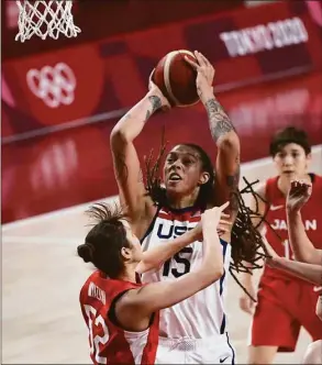  ?? Aris Messinis /AFP / TNS ?? The USA’s Brittney Griner shoots the ball as Japan’s Yuki Miyazawa tries to block in the women’s preliminar­y round group B match during the Tokyo 2020 Olympic Games at the Saitama Super Arena in Saitama on July 30, 2021.