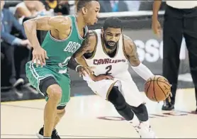  ?? FOTO: EFE ?? Kyrie Irving, base de Cleveland Cavaliers, superando a Avery Bradley, de Boston Celtics