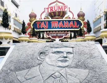  ?? WAYNE PARRY/AP ?? A plaque outside the Trump Taj Mahal depicts Donald Trump, who built the casino resort for $1.2 billion in 1990.