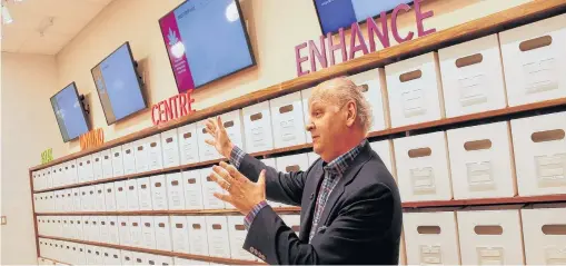  ?? • TIM KROCHAK THE CHRONICLE HERALD ?? Bret Mitchell, president and CEO of NSLC, gives a tour of the cannabis section of the Joseph Howe Drive store in Halifax on July 18.