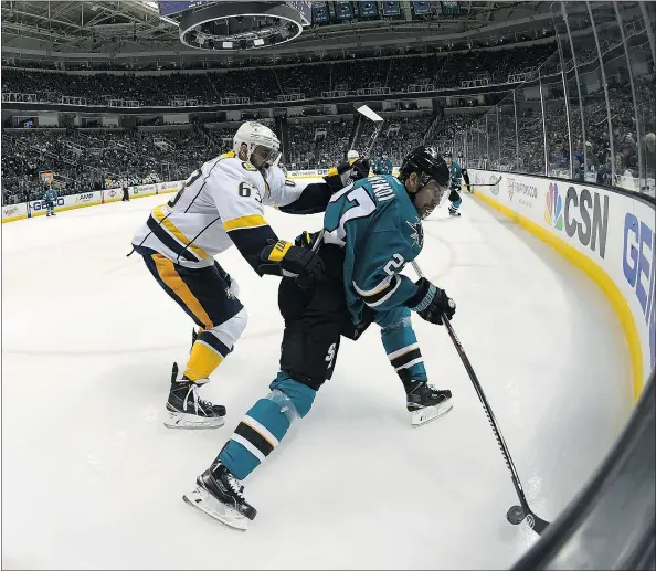  ?? — GETTY IMAGES FILES ?? Joonas Donskoi, right, of the San Jose Sharks and Filip Forsberg of the Nashville Predators battle for the puck during the Sharks’ 3-2 win in Game 2 Sunday. The Predators dropped the first two games of the best-of-seven series and return home Tuesday night.