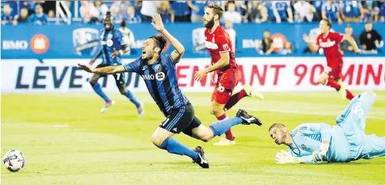  ?? JOHN MAHONEY ?? The Impact’s Matteo Mancosu is tripped up by Chicago Fire goalkeeper Matt Lampson during an August match. It was a disappoint­ing year for Montreal’s MLS team.