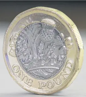  ?? Picture: PA. ?? The new £1 coin was hailed as having a range of hi-tech features making it extremely difficult to counterfei­t.