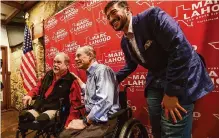  ?? Marvin Pfeiffer/staff photograph­er ?? Texas House District 121 candidate Marc Lahood, right, celebrates support Feb. 8 from Gov. Greg Abbott.