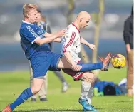  ??  ?? FC Polonia (white) and Tayport battled it out at Riverside in the Sunday League. Tayport won 2-1.