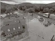  ?? / Contribute­d-RFCEMA ?? Cave Spring is returning to normal this weekend after Thursday flooding that virtually shut down the downtown community. This is a Rome-Floyd County EMA drone shot looking toward the south.