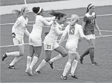  ?? [PHOTO PROVIDED] ?? OSU celebrates its Bedlam soccer victory over OU on Wednesday in Kansas City, Missouri.