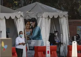  ?? DAMIAN DOVARGANES — THE ASSOCIATED PRESS ?? Medical tents for vaccinatio­ns stand outside Children’s Hospital Los Angeles on Friday. In the last week, California has reported more than 250,000 coronaviru­s cases and 1,500 deaths.