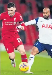  ??  ?? Man on: Andy Robertson battles with Lucas Moura at Anfield