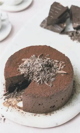  ??  ?? SWEET TREAT: Flourless chocolate mousse cake and, below left, Raymond Blanc.