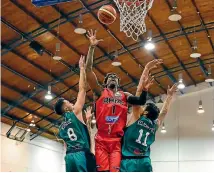  ?? PHOTO: PHOTOSPORT ?? Rams import forward Winston Shepard shoots sandwiched by two Super City defenders during last night’s NBL match won by the Rams 100-95 at Cowles Stadium last night.