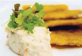  ??  ?? Caramelise­d onion-and-salmon dip with fried green plantain.