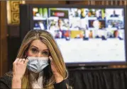  ?? TONI L. SANDYS / POOL VIA THE NEW YORK TIMES ?? Sen. Kelly Loeffler, R-Ga., removes her mask to speak at a Senate committee hearing on the coronaviru­s response on Tuesday.