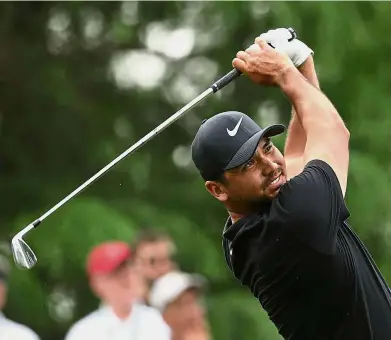  ??  ?? Off it goes: Jason Day hitting a tee shot on the 13th hole during the third round of the Wells Fargo Championsh­ip at Quail Hollow in North Carolina on Saturday. — AFP