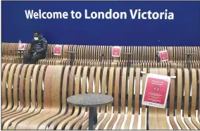  ?? (AP/Kirsty Wiggleswor­th) ?? Seats display social distancing instructio­ns Monday at Victoria Station in London.