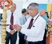  ??  ?? Kulathunga Rajapaksa, Managing Director, DSI Samson Group (Pvt) Ltd, lighting the oil lamp