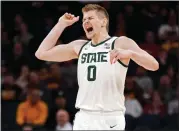  ?? ABBIE PARR — THE ASSOCIATED PRESS ?? Michigan State forward Jaxon Kohler celebrates after a dunk by teammate forward Malik Hall during the first half of Thursday’s game against Minnesota in the second round of the Big Ten Conference tournament in Minneapoli­s.