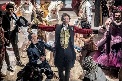  ??  ?? “No one ever made a difference by being like everyone else”: P.T. Barnum (Hugh Jackman) belts out a song accompanie­d by his circus performers in The Greatest Showman.