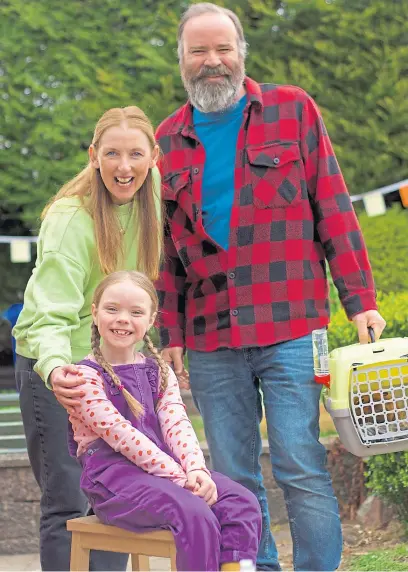  ?? Picture Thomas Skinner ?? Real-life acting couple Julie Wilson Nimmo and Greg Hemphill as Mr and Mrs Sawdust, mum and dad to Karen, played by Isla Mercer, left, in Olga da Polga and, below, late creator Michael Bond with daughter Karen, who inspired the books