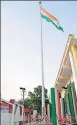  ?? HT ?? (Above) The 100ft high flag and (top) CM Yogi Adityanath inaugurati­ng the same at DDU University.