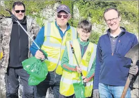  ?? ?? Activity on the bridge at Glanworth spring clean, pictured are Keith Hunt, PJ and Danny Browne and Mark Conran.