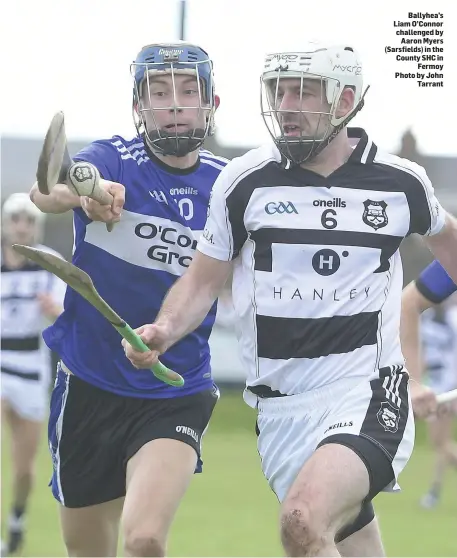  ??  ?? Ballyhea’s Liam O’Connor challenged by Aaron Myers (Sarsfields) in the County SHC in Fermoy Photo by John Tarrant