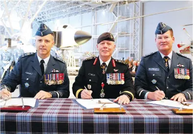  ?? PATRICK DOYLE / THE CANADIAN PRESS FILES ?? The change-of-command ceremony involving Jonathan Vance, centre, incoming commander Lt.-gen. Al Meinzinger, left, and outgoing commander Lt.-gen. Mike Hood in May was downgraded following criticism.