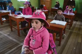  ?? Martin Mejia / Associated Press ?? Students attend a Quechua language class at a public primary school in Licapa, Peru. The school began teaching Quechua for the first time in April.