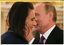  ?? FOTO PHOTO NEWS ?? De Russische president troost thuisblijf­ster en tweevoudig olympisch polsstokka­mpioene Yelena Isinbayeva.