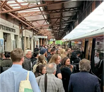  ?? FRASER PITHIE ?? A busy view of Leamington Spa station on June 3, 2019 at 18.00 as passengers surge forward to board a West Midlands Class 172 to Kenilworth, Coventry and Nuneaton. Overcrowdi­ng can lead to extended station dwell times, exacerbati­ng lateness at subsequent stations and further afield.