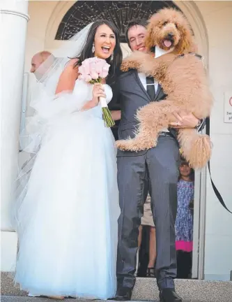  ?? Picture: CHI CHI MODERN EVENT PHOTOGRAPH­Y ?? Damien and Cass McGregor-Lowndes celebrate their wedding with George, their labrador cross poodle.