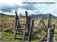  ??  ?? Two stiles with a view of Snowdon.