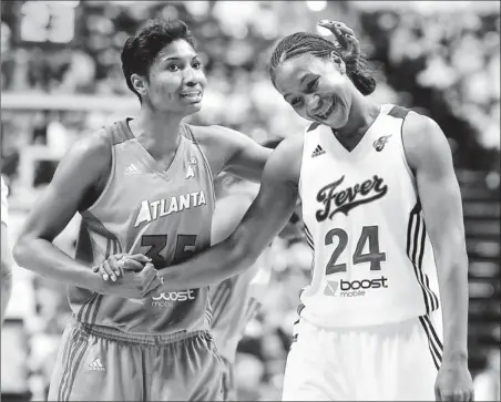  ?? By Rob Goebel, AP ?? Buddy system: Angel McCoughtry, left, says being teammates with players she normally opposes, like Tamika Catchings (24), helps her improve her game.