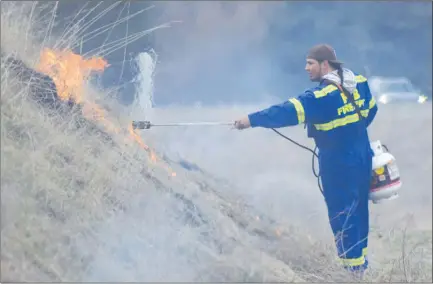  ?? JOE FRIES/Penticton Herald ?? Will Poitras of the Penticton Indian Band Fire Department lights up dead grass along the Okanagan River channel on Thursday as part of a larger program of prescribed burning carried out in the community this week.