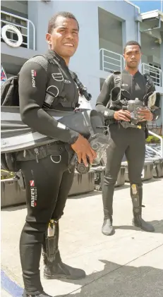  ?? Ronald Kumar ?? Fiji Navy divers (left) AB Ratu Vitukawalu and Ligani Buladreket­i with some of the diving equipment donated by the United States Government, October 12, 2021. Photo: