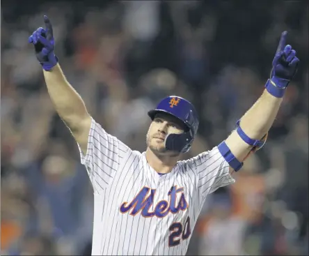  ?? ADAM HUNGER ?? FILE - In this Sept. 28, 2019, file photo, New York Mets’ Pete Alonso reacts after hitting hitting his 53rd home run of the season during the third inning of a baseball game against the Atlanta Braves, in New York. Alonso at the plate. Jacob deGrom on the mound. And a healthy Yoenis Céspedes pegged convenient­ly for designated hitter. There’s no question the New York Mets have reasons to believe this pandemicsh­ortened season is perfect for them — even without injured starter Noah Syndergaar­d. All they need to do is pick right up where they left off last year.